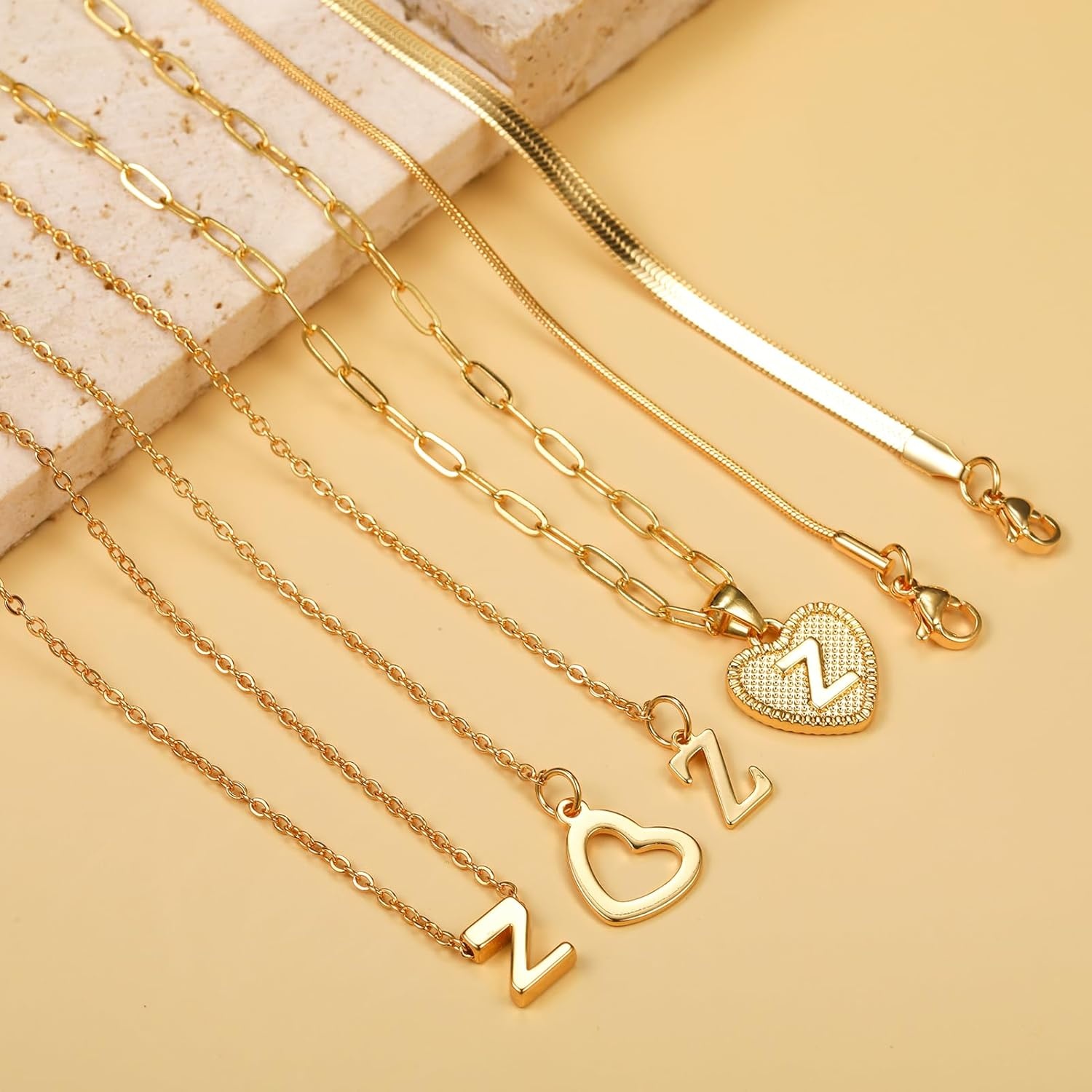 image:imageFAXHION Gold Initial Necklaces for Women 3 Pcs 14K Gold Plated Letter Heart Pendant Necklaces Dainty Gold Letter Necklace Set Layering Choker Necklace for GiftGold