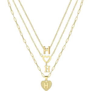 image:imageFAXHION Gold Initial Necklaces for Women 3 Pcs 14K Gold Plated Letter Heart Pendant Necklaces Dainty Gold Letter Necklace Set Layering Choker Necklace for GiftGold